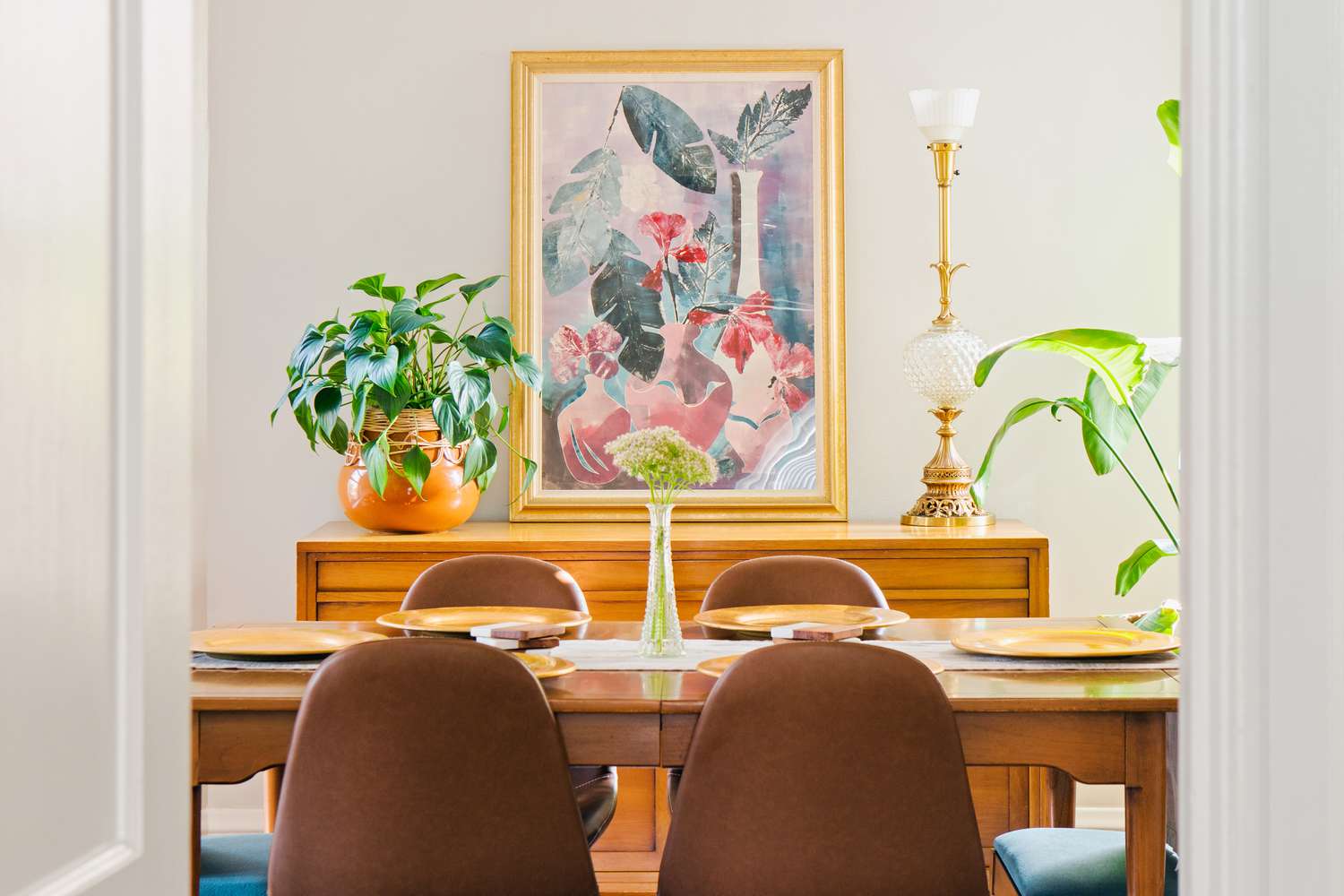 Artwork hanging in middle of dining room decorated with feng shui tips